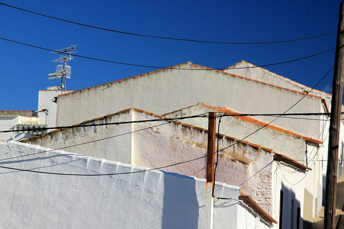 Building Work on Your Own House in Portugal in 2026: A Practical Guide to the 10 Square Metre Shed, the 1.8 Metre Wall, and What Needs No Council Permission