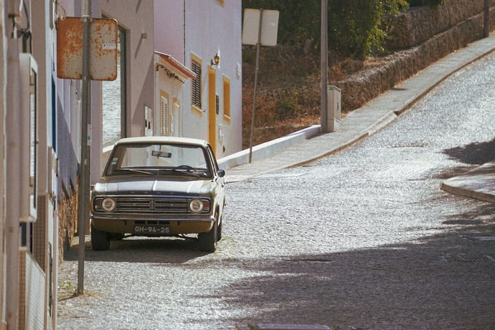 Importing a Car to Portugal in 2026 — The Transferência de Residência ISV Exemption, the DAV Customs Declaration, the Modelo 112 Inspection, the IMT Homologation, and What the Process Actually Costs