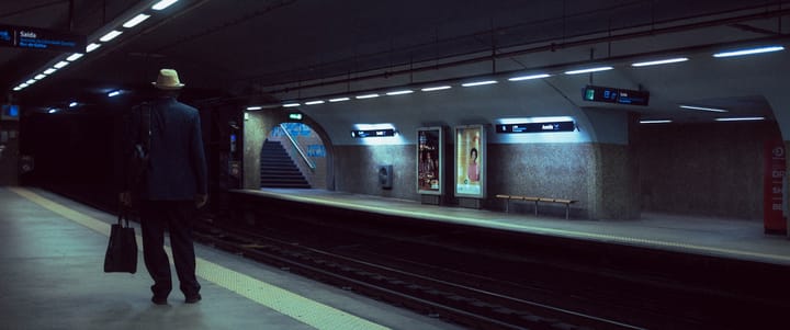 Passenger waiting on a Lisbon Metro platform in Portugal