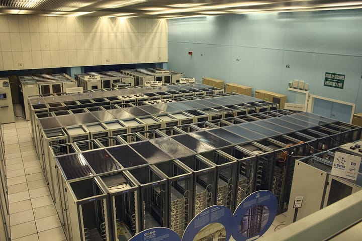 Rows of computer server racks inside a large high-performance computing data centre
