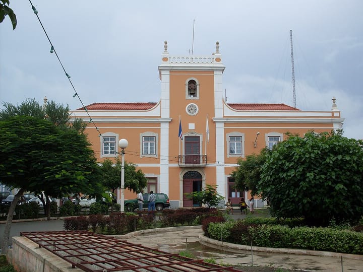 The orange colonial-era City Hall of Praia, the capital of Cape Verde, with the national flag flying