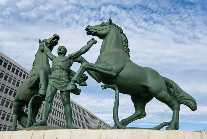 The bronze allegorical monument 'A Justiça' by Leopoldo de Almeida outside the modernist Palacio da Justica courthouse in Lisbon