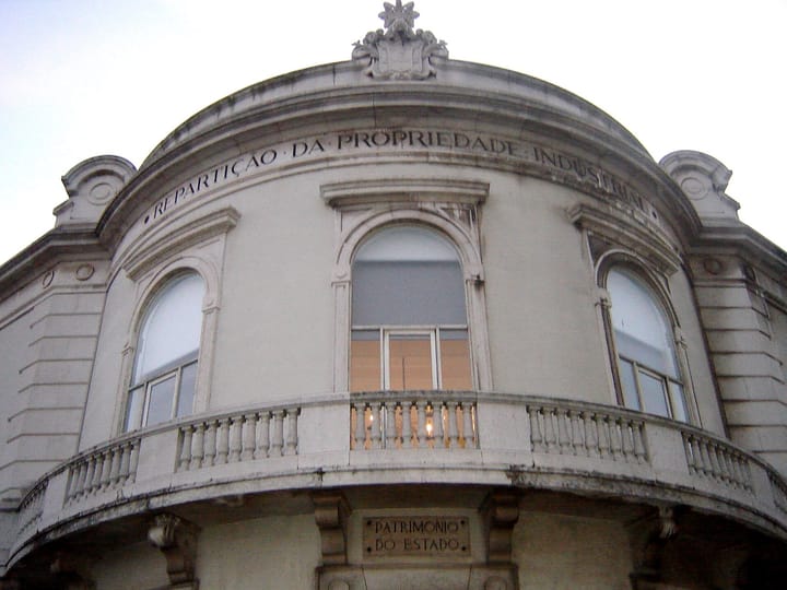 The stone facade of the INPI building in Lisbon carved with the words Reparticao da Propriedade Industrial