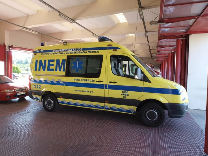 A yellow INEM emergency medical ambulance parked in a station in Portugal