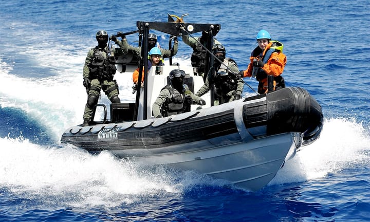Portuguese Navy fuzileiros aboard a Marinha rigid-hulled inflatable boat during a boarding drill at sea