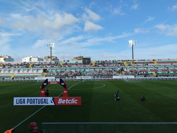 The Estadio Jose Gomes in Reboleira, Amadora, before a Liga Portugal fixture, with the green, red and white stand behind the pitch