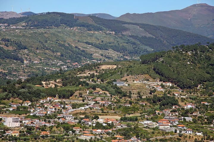 The rural hillside parish of Frende in the municipality of Baião, northern Portugal, with scattered red-roofed houses, terraced fields and wooded hills
