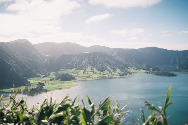 The Sete Cidades crater lake and green caldera fields on Sao Miguel island in the Azores, seen from the rim above