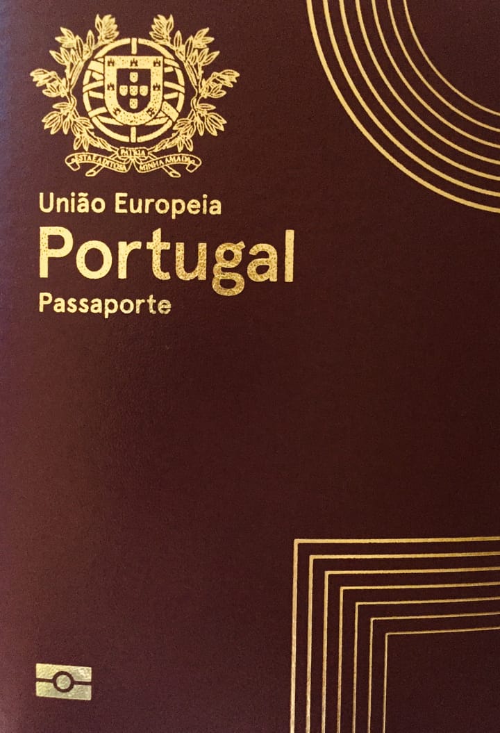 The burgundy cover of a Portuguese biometric passport, with the national coat of arms and the words Uniao Europeia, Portugal and Passaporte stamped in gold.