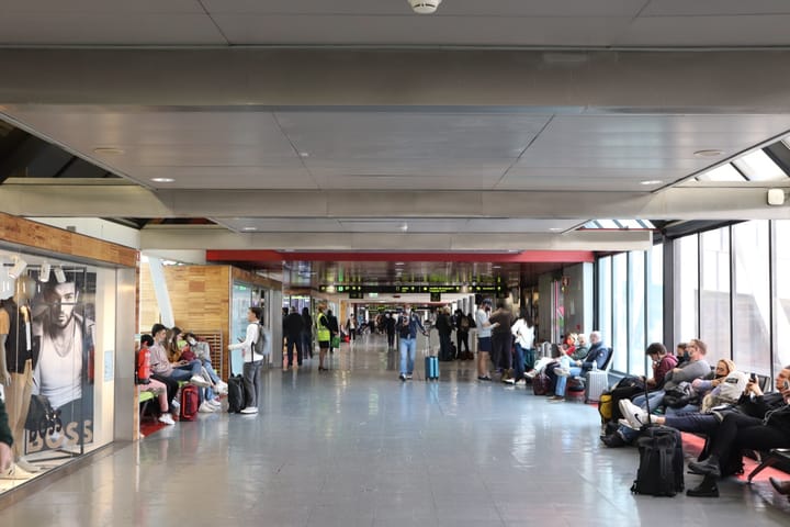 The departures area of Lisbon's Humberto Delgado Airport, or a passenger aircraft at a Portuguese airport
