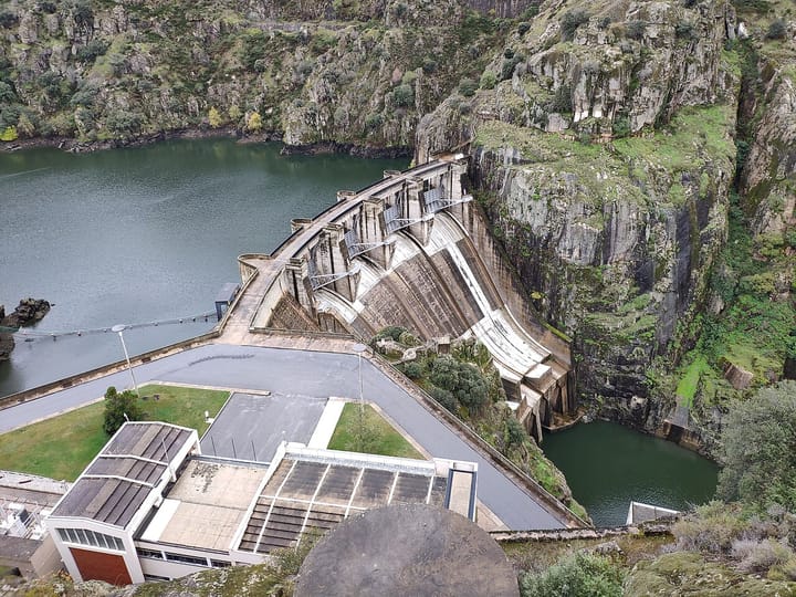 The arched concrete wall of the Picote dam in the Douro Internacional gorge in north-east Portugal