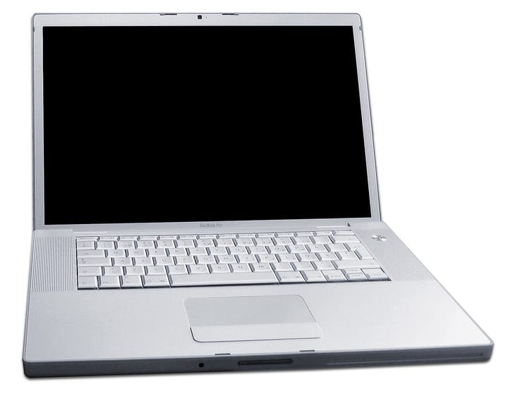 An open Apple MacBook Pro laptop with a silver aluminium body and a blank black screen