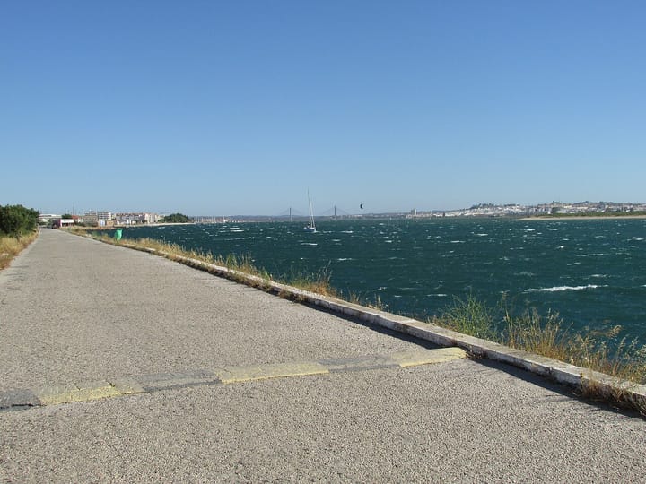 The Guadiana estuary at Vila Real de Santo Antonio in the eastern Algarve, looking across choppy water towards the Guadiana International Bridge and the Spanish bank
