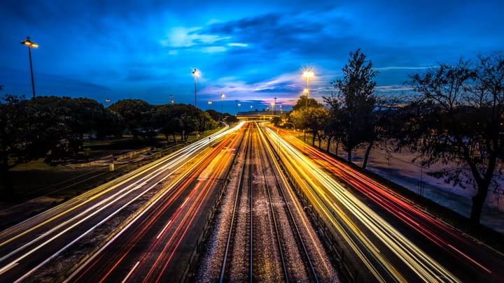Light trails from evening traffic on a multi-lane road through Lisbon