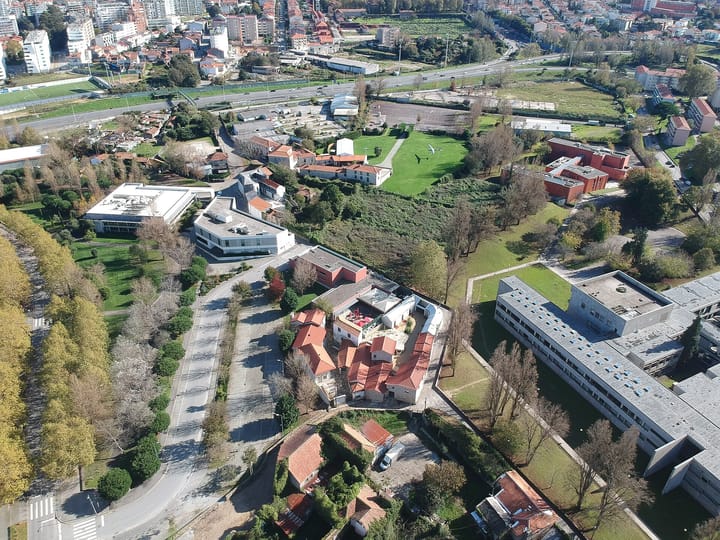 An aerial view of the Asprela university district in Porto, with campus buildings and housing