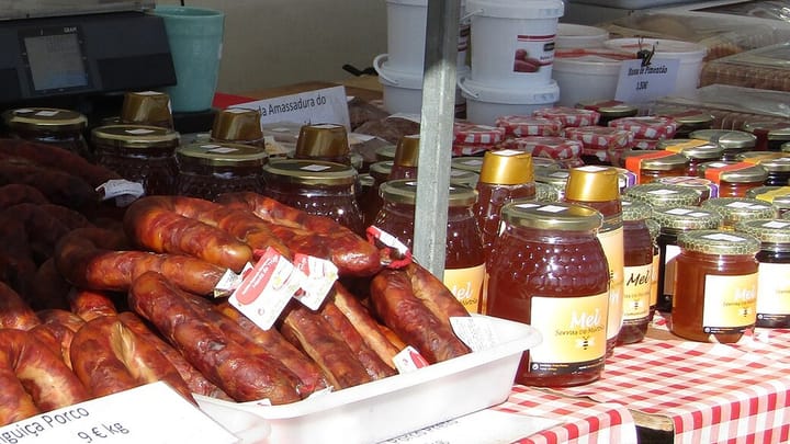 Jars of Serras de Mértola honey on a market stall in Algoz, Algarve