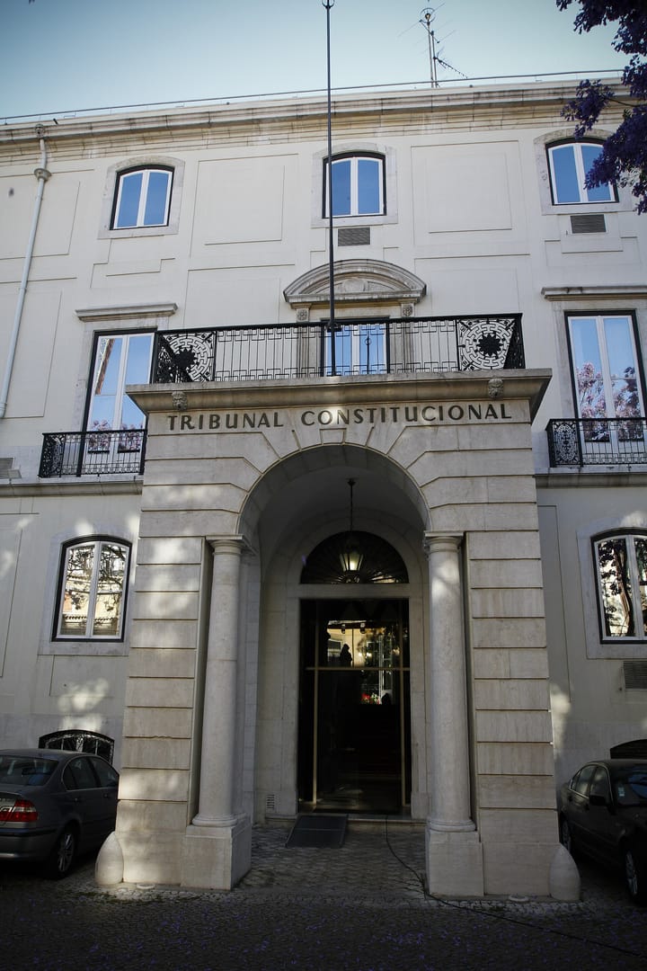 The arched stone entrance of the Palacio Ratton in Lisbon with Tribunal Constitucional carved on the lintel above it
