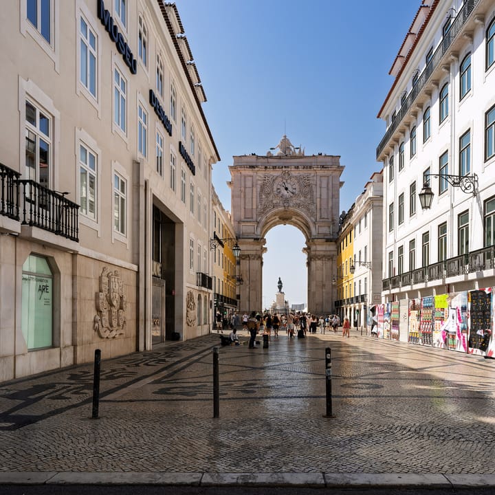 The Arco da Rua Augusta in Lisbon seen from the Rua do Comercio, with the statue of King Jose I and the Praca do Comercio framed in the archway beyond