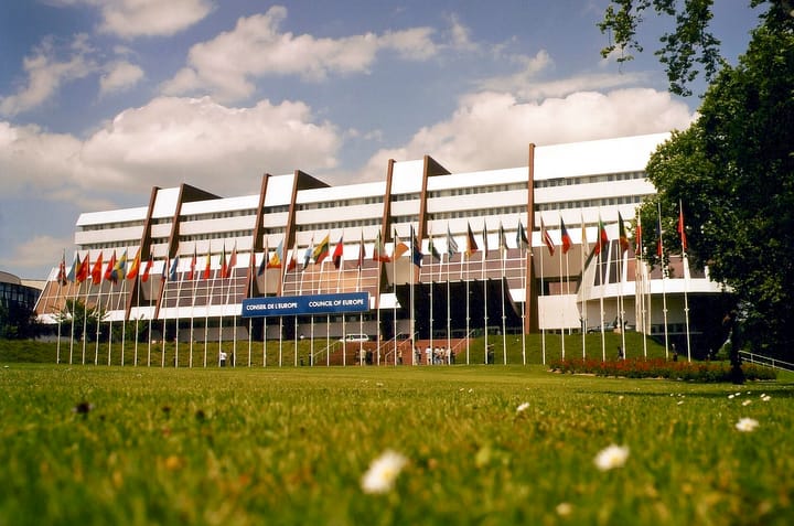 The Palais de l'Europe in Strasbourg, seat of the Council of Europe, with a row of member states' flags in front of the entrance